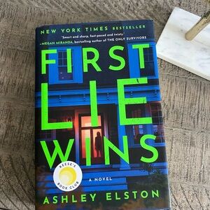 First Lie Wins by Ashley Elston - Bright Blue & Neon Green Hardcover